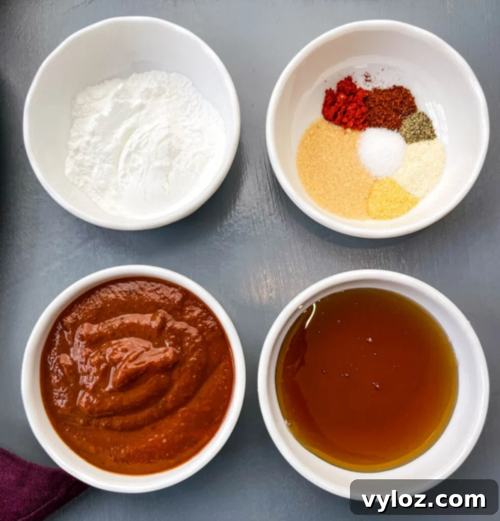 baking powder, BBQ rub, maple syrup, and BBQ sauce in separate white bowls