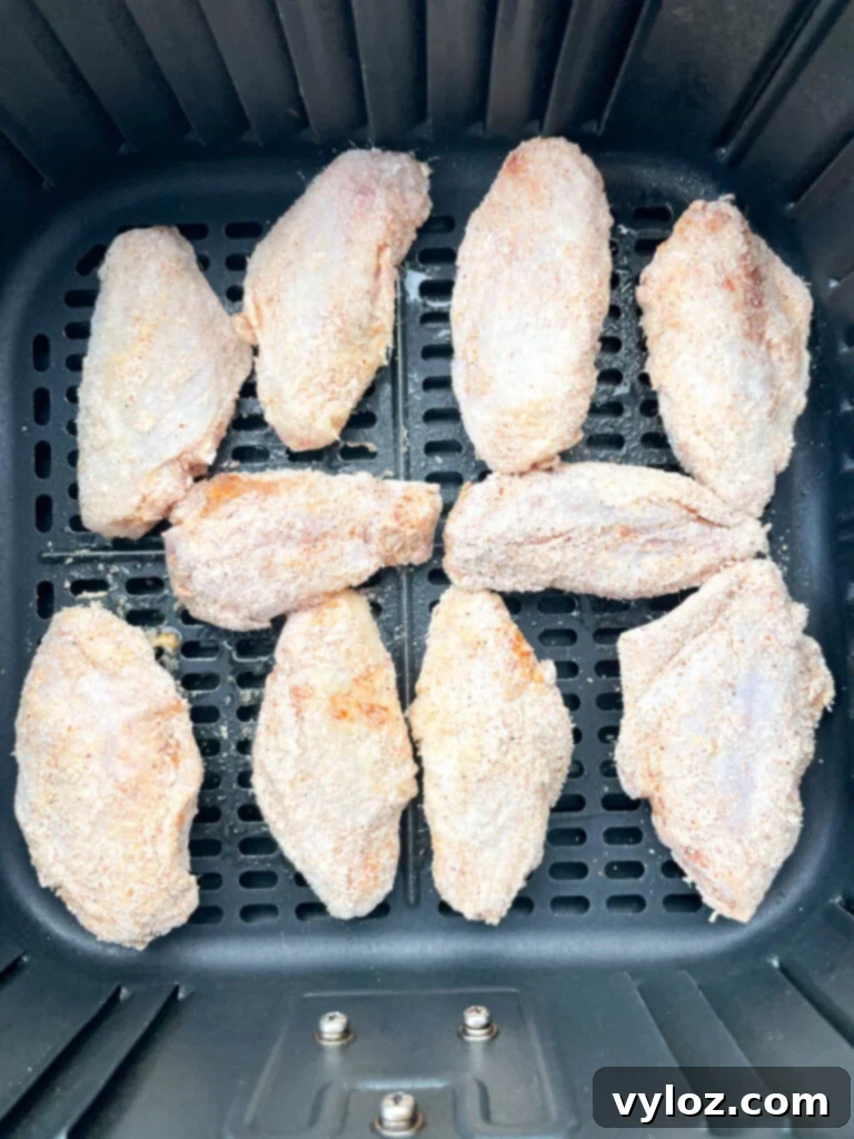 raw chicken wings on a basket