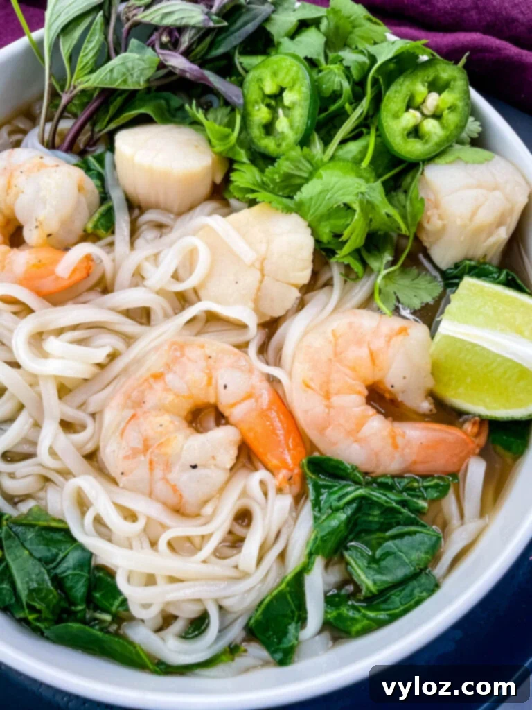 seafood shrimp pho in a white bowl