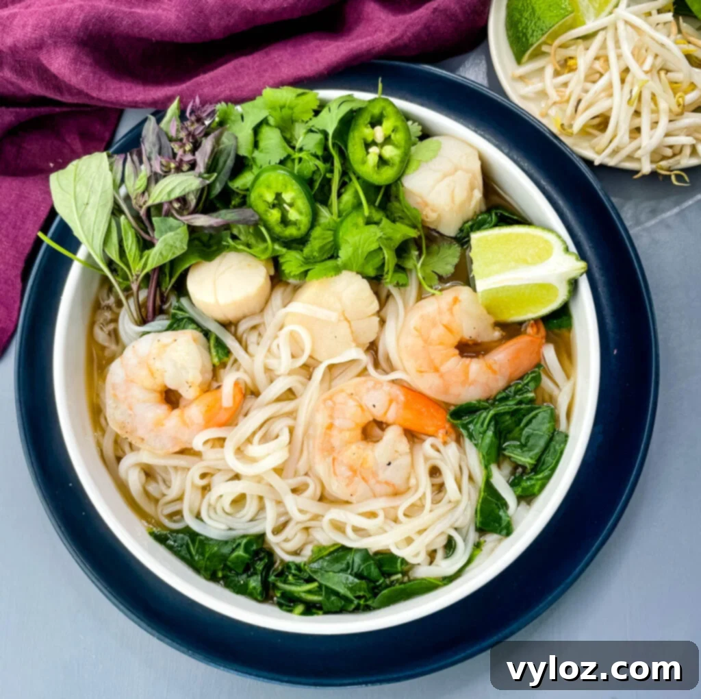 seafood shrimp pho in a white bowl