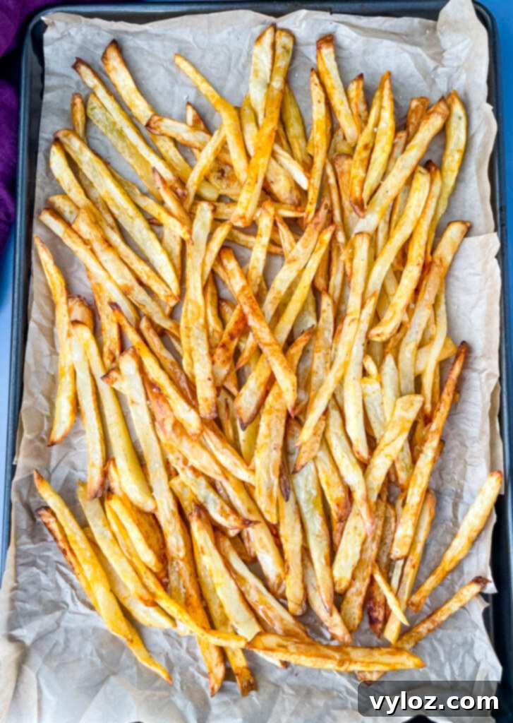 cooked French fries on a sheet pan