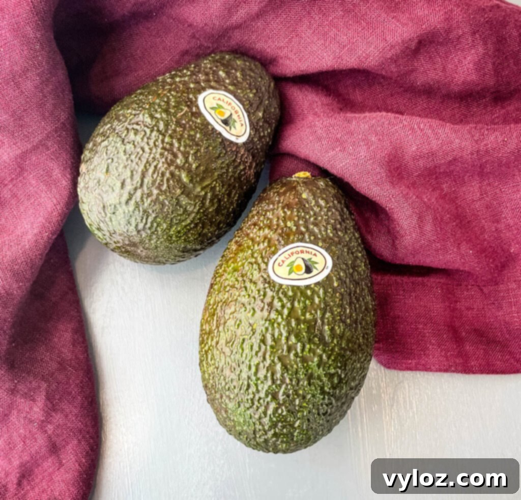 fresh unpeeled avocados