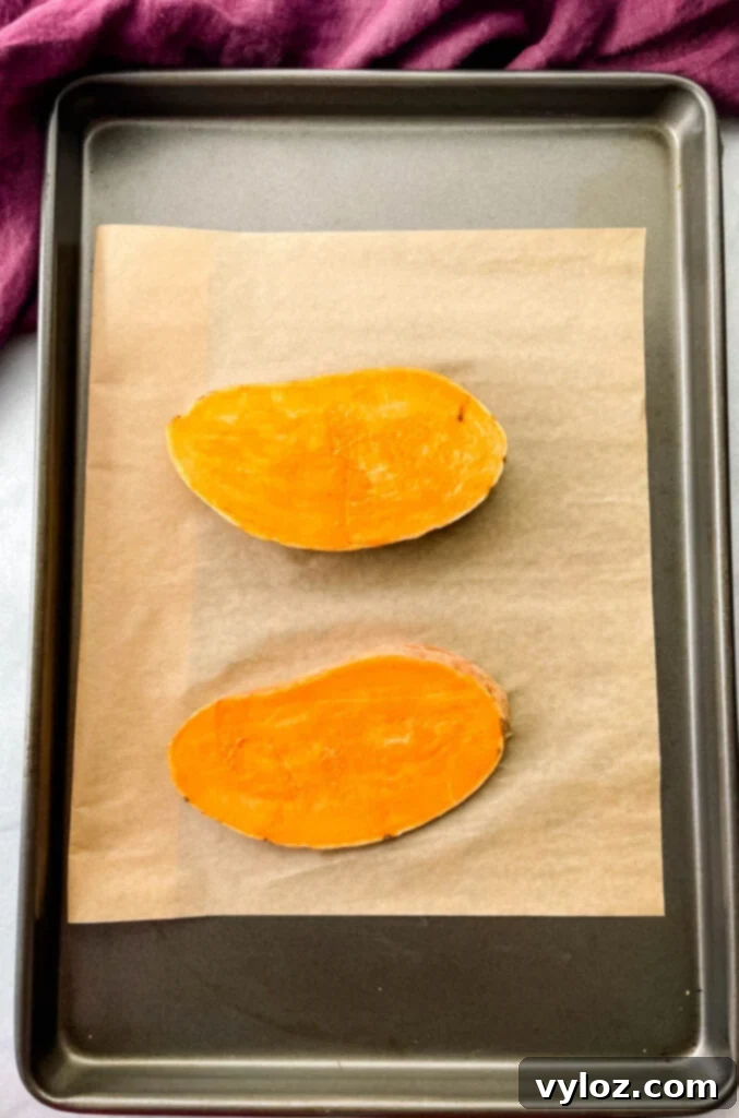 sliced sweet potatoes on a sheet pan