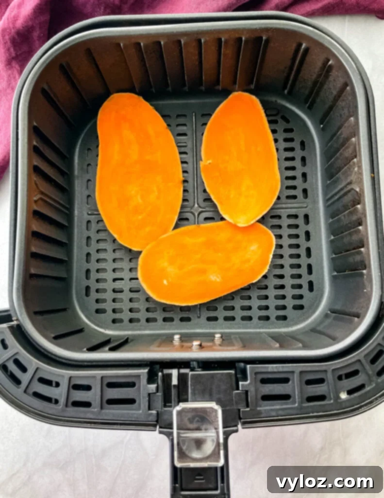 sliced sweet potatoes in an air fryer