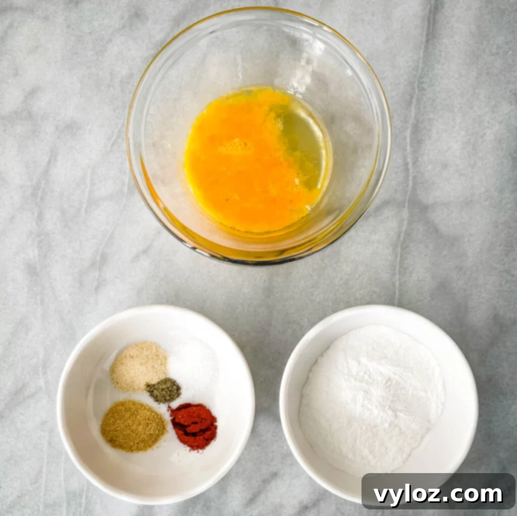 raw beaten egg, baking powder, and spices in separate bowls