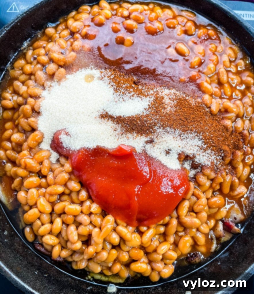 baked beans, ketchup, BBQ sauce, and brown sugar in a cast iron skillet