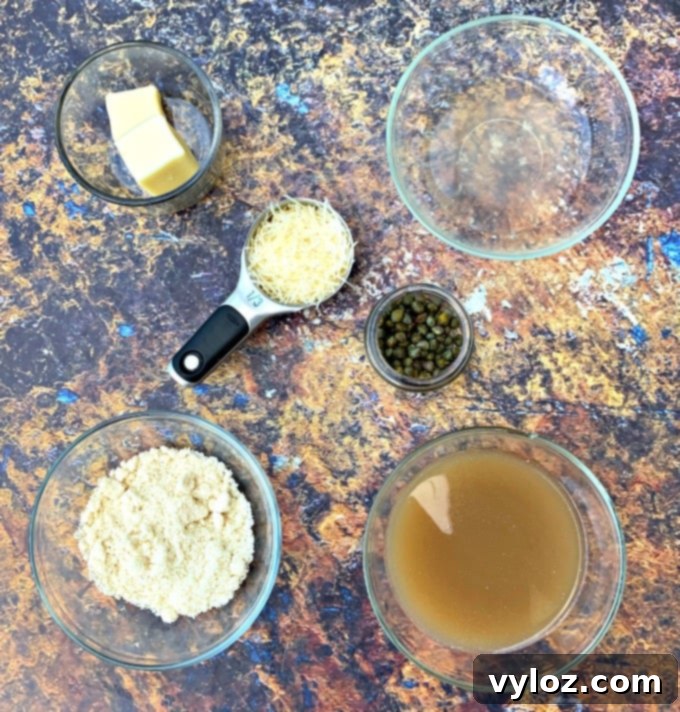 Ingredients for Keto Lemon Chicken Piccata laid out on a table.