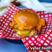 A delicious air-fried Chick-fil-A style chicken sandwich, complete with pickles, served in a bowl, showcasing the healthy and convenient results of air frying.