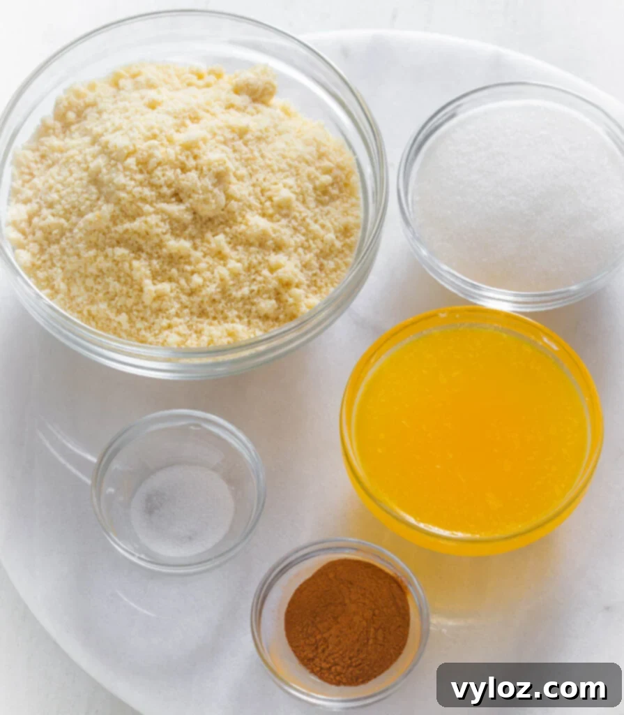 Guilt-Free Key Lime Bliss 3 Bowls of almond flour, monk fruit sweetener, melted butter, cinnamon, and salt, essential ingredients for a low carb graham cracker crust.