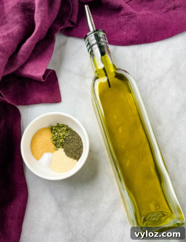 Crispy Ranch Roasted Potatoes 5 Homemade ranch seasoning in a bowl next to a bottle of olive oil