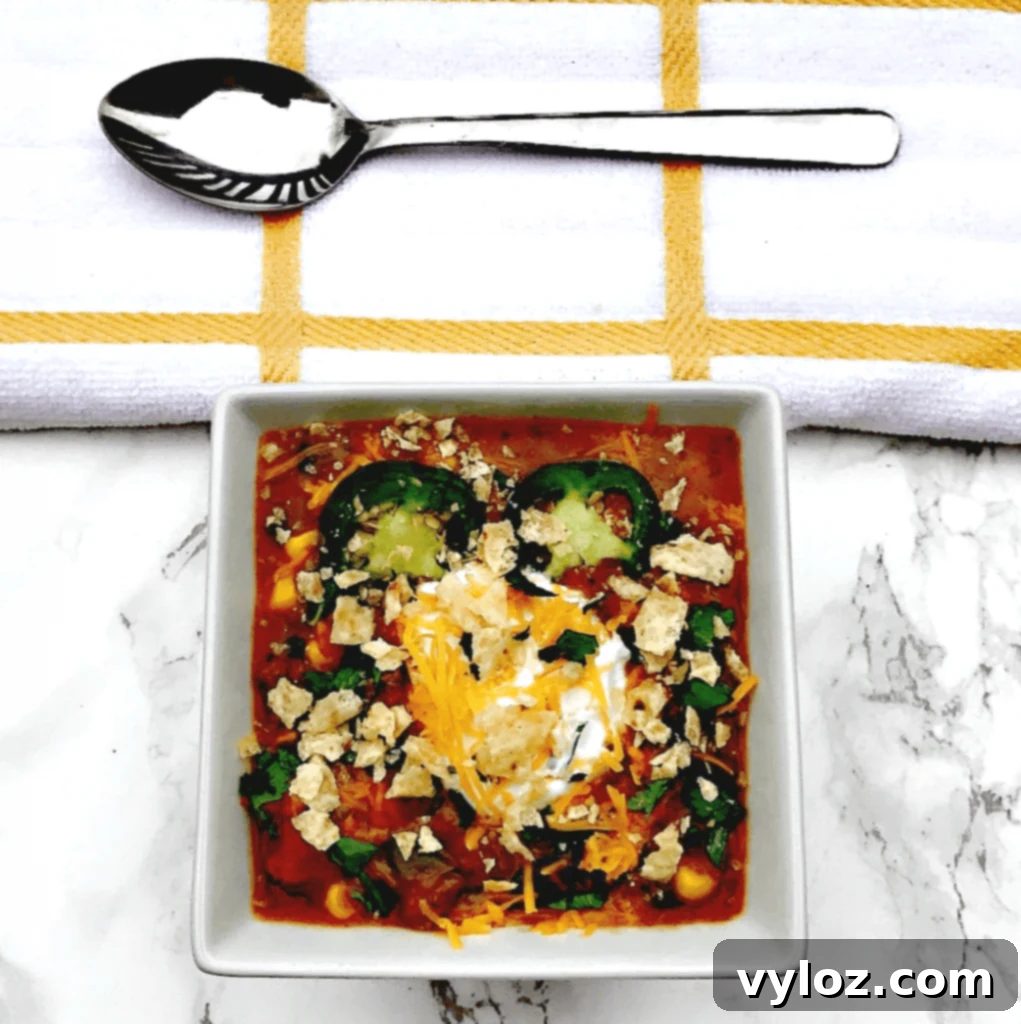 Slow Cooker Beef Fiesta Chili 7 Top-down view of Slow-Cooker Beef Taco Nacho Chili cooking in a crock pot