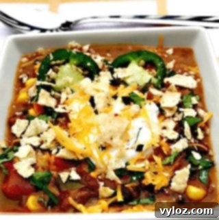 Slow Cooker Beef Fiesta Chili 9 Slow-Cooker Beef Taco Nacho Chili in a white bowl