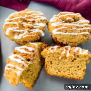 Simple Cinnamon Streusel Coffee Cake Muffins 12 coffee cake muffins with icing on a flat surface