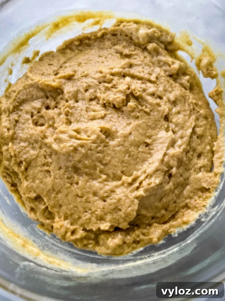 Simple Cinnamon Streusel Coffee Cake Muffins 6 coffee cake muffin batter in a glass bowl