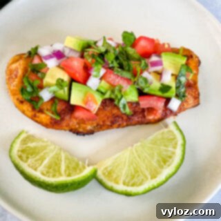 Vibrant Chicken Avocado Salsa 11 cooked chicken and avocado salsa on a plate with limes
