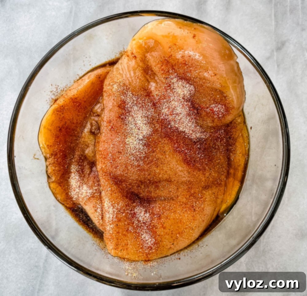 Vibrant Chicken Avocado Salsa 5 raw chicken breasts in a glass bowl with a marinade