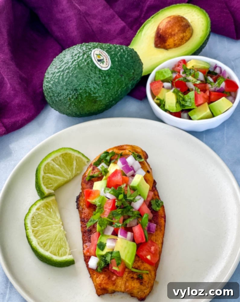 Vibrant Chicken Avocado Salsa 10 cooked chicken and avocado salsa on a plate with limes