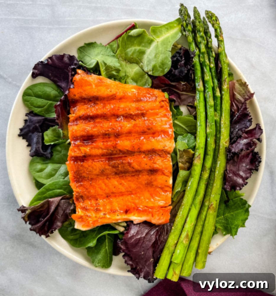Sweet and Simple Maple Salmon 8 maple glazed salmon on a plate with asparagus and mixed greens