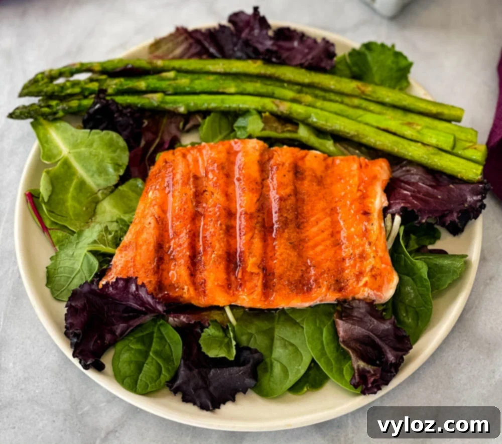 Sweet and Simple Maple Salmon 9 maple glazed salmon on a plate with asparagus and mixed greens