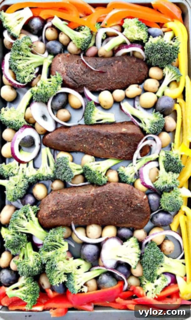 One-Pan Steak and Veggies Meal Prep 4 Sheet pan loaded with sirloin steak, broccoli, bell peppers, and potatoes