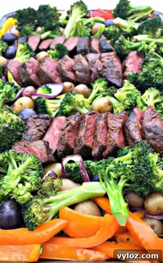 One-Pan Steak and Veggies Meal Prep 6 Overview of baking pan with steak and veggies, close up