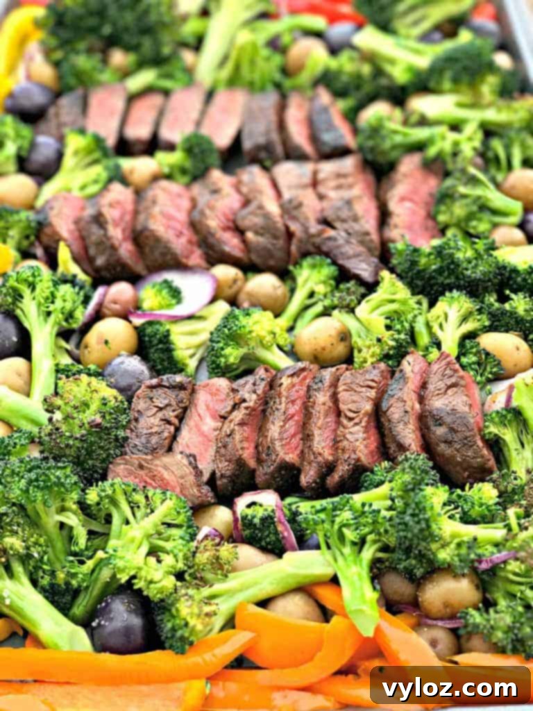 One-Pan Steak and Veggies Meal Prep 9 Colorful assortment of roasted vegetables on a sheet pan