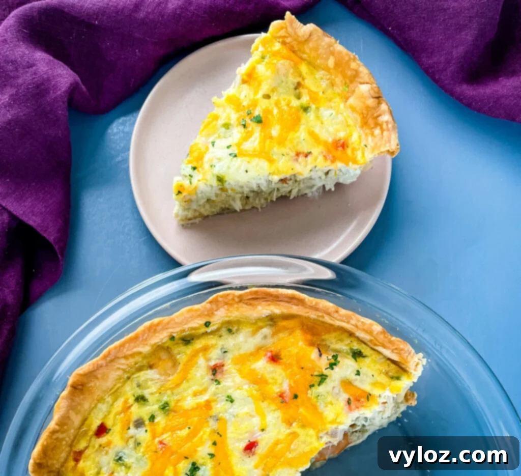 A golden-brown shrimp and crab quiche on a plate, ready to be served for breakfast or brunch.