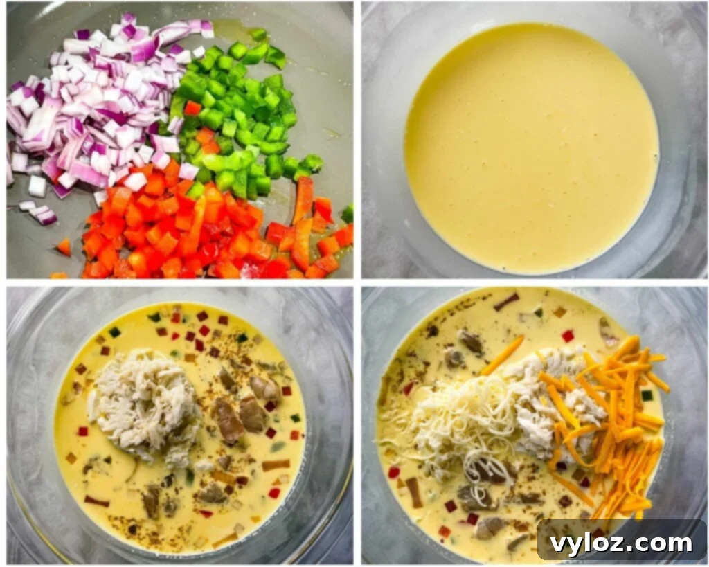 A glass bowl filled with the quiche mixture: whisked eggs, colorful chopped vegetables, shredded cheese, and lump crab meat.