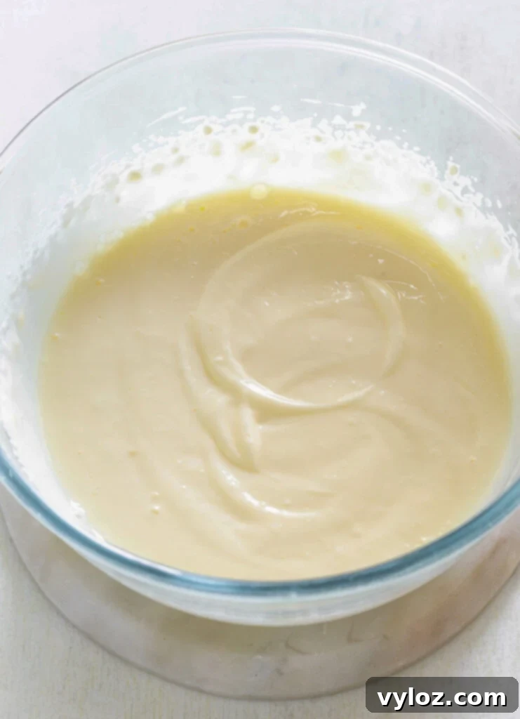 Close-up of the smooth, creamy filling being mixed in a bowl, showcasing its perfect texture.