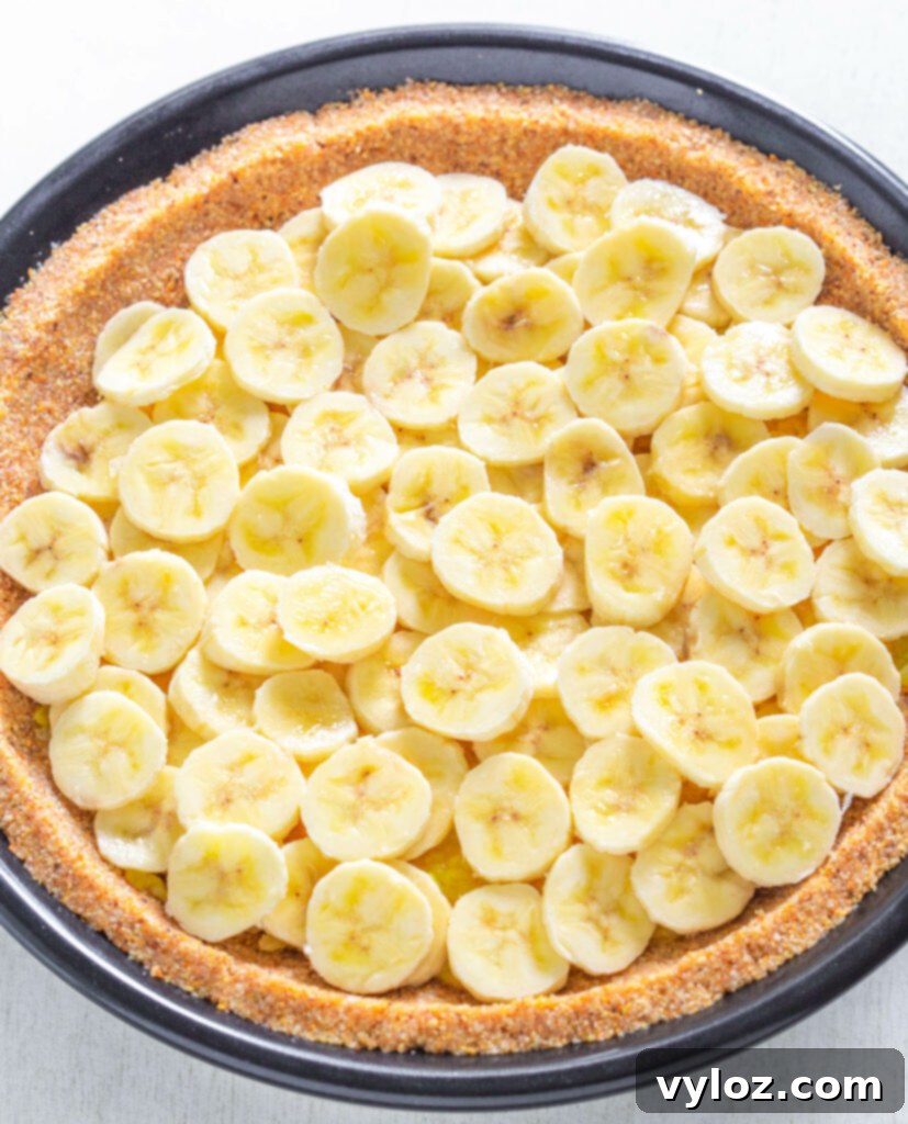 A close-up shot of the cream cheese filling being mixed in a bowl, showing its smooth consistency.