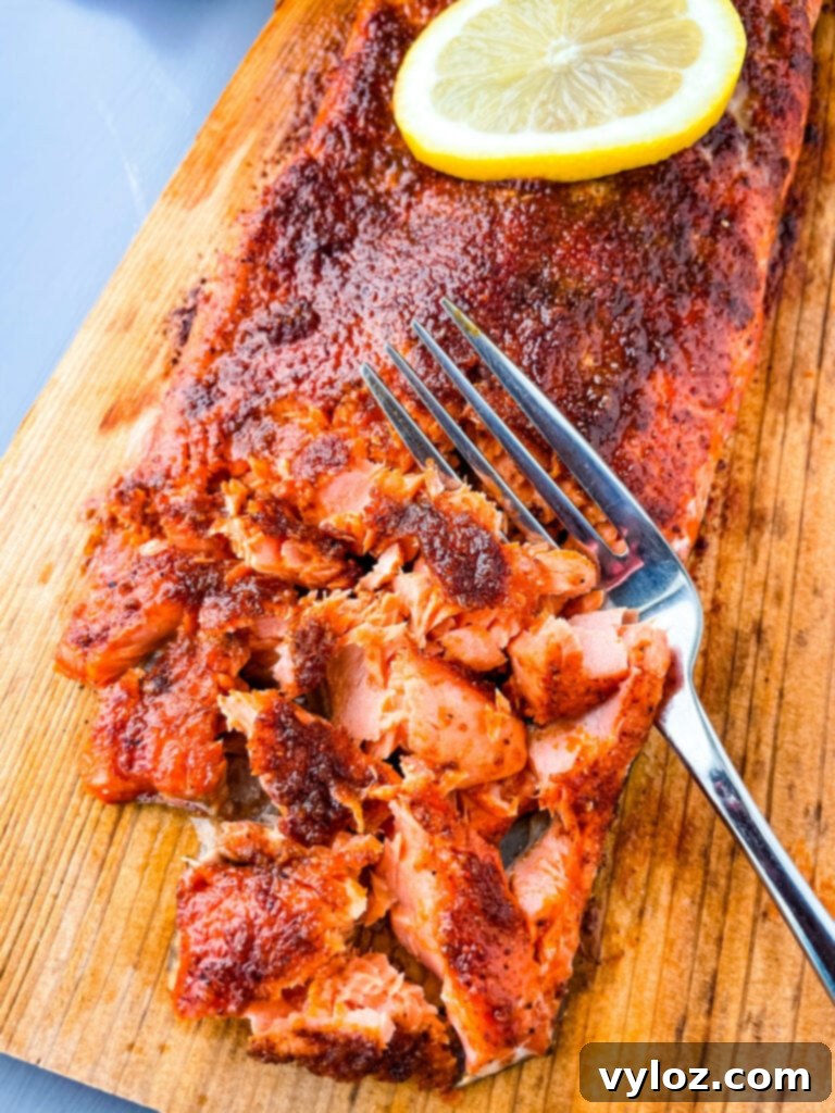 grilled salmon on a cedar plank sliced up