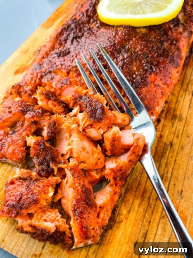 grilled salmon on a cedar plank sliced up