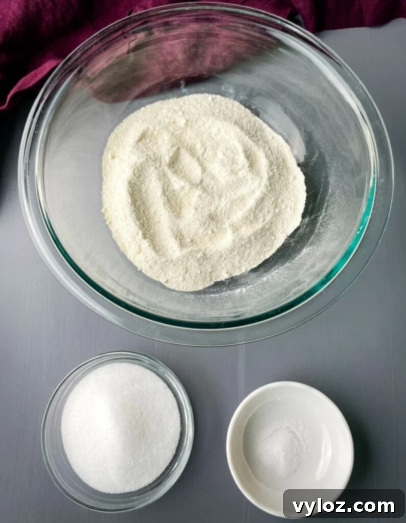 self rising cornmeal, sweetener, and salt in separate glass bowls