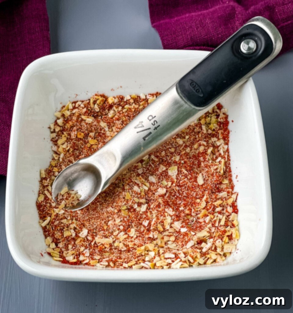 Secret Burger Spice 4 homemade Burger seasoning and rub in a white bowl