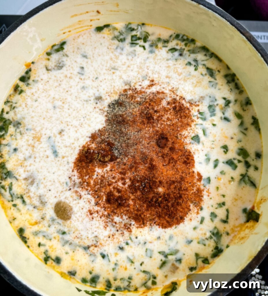 Golden Queso Dip 7 uncooked queso cheese dip in a sauce pan