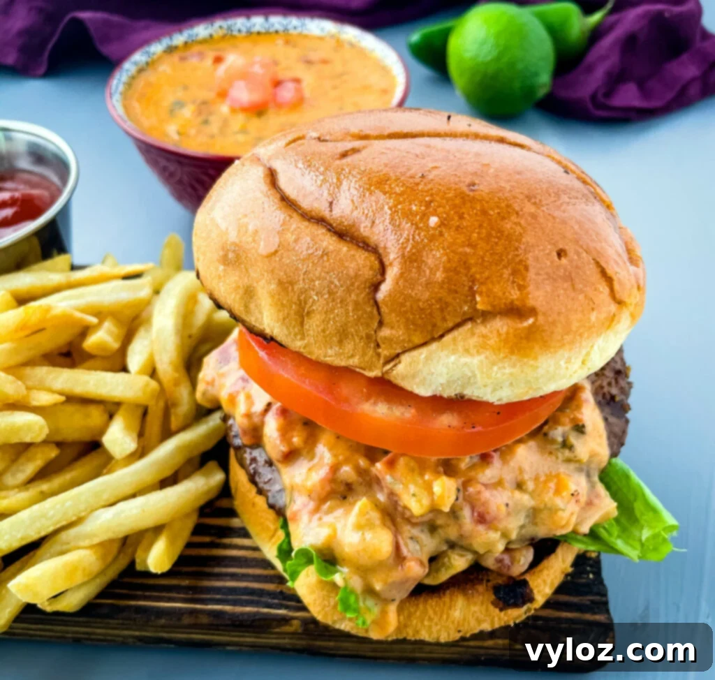 Gooey Queso Burgers 11 Perfectly assembled queso burgers on buns, served with a side of golden French fries