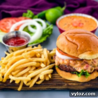 Gooey Queso Burgers 12 Queso burgers served on a plate with crispy French fries