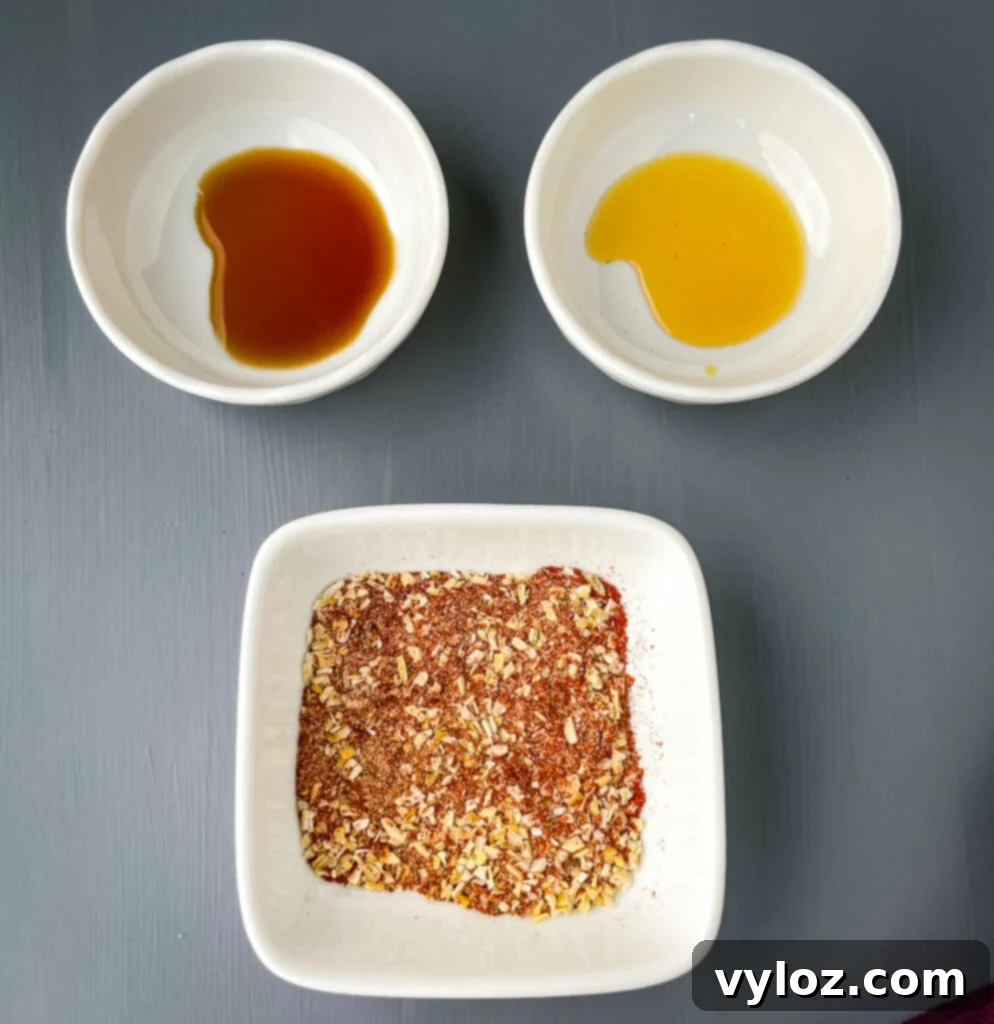 Gooey Queso Burgers 4 Worcestershire sauce, liquid smoke, and a homemade BBQ rub displayed in separate small bowls