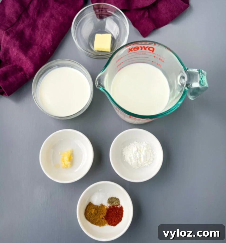 Gooey Queso Burgers 6 Collection of queso dip ingredients including butter, milk, half and half, various seasonings, and cornstarch in individual bowls