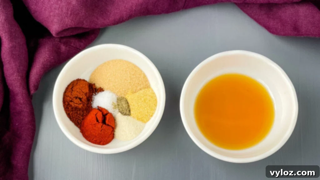 BBQ rub seasoning and liquid smoke on a cutting board