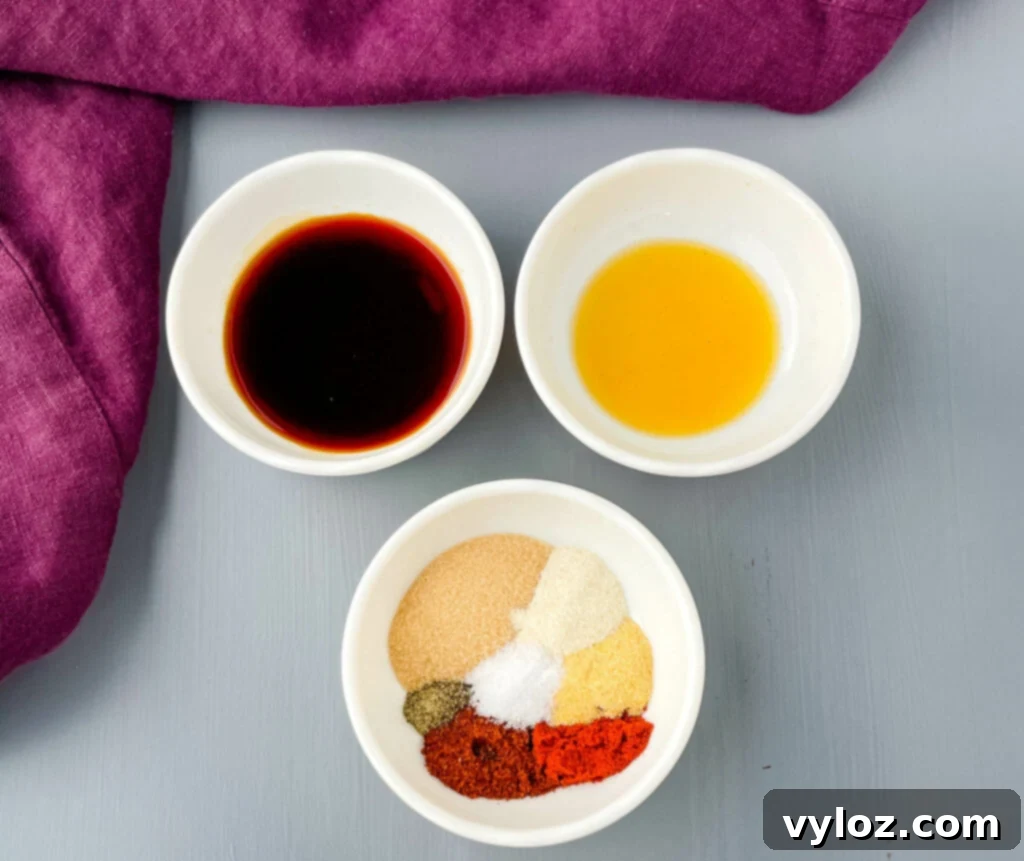 Perfect Grilled Chicken Wings 4 Liquid smoke, soy sauce, and BBQ rub in separate bowls, ready for marination