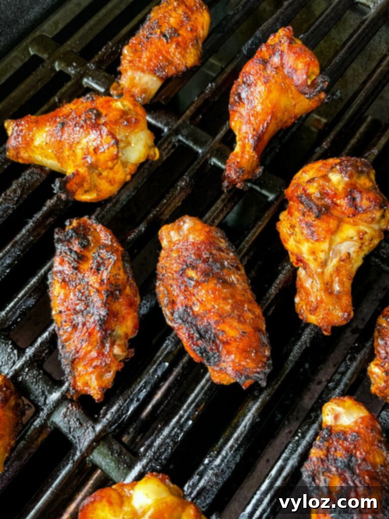 Perfect Grilled Chicken Wings 9 Perfectly grilled chicken wings on the barbecue, ready to be served
