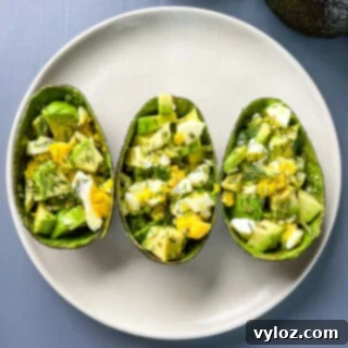 Savory Avocado Egg Bites 6 Avocado Egg Salad Cups on a serving plate