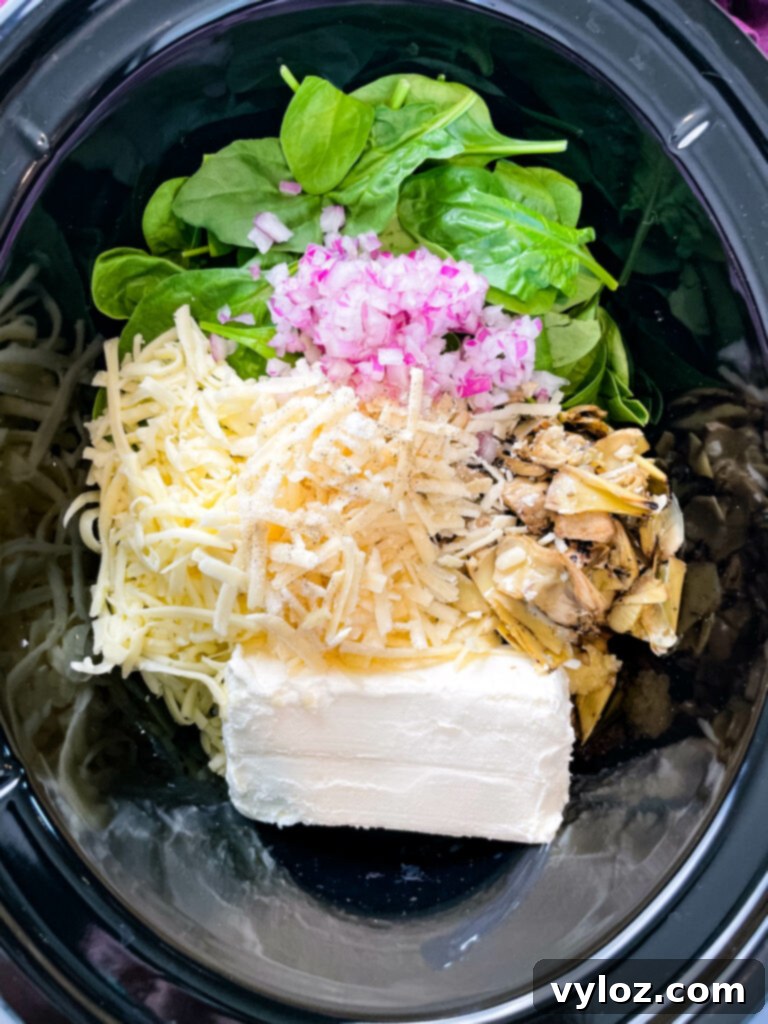 bacon spinach artichoke dip in a slow cooker