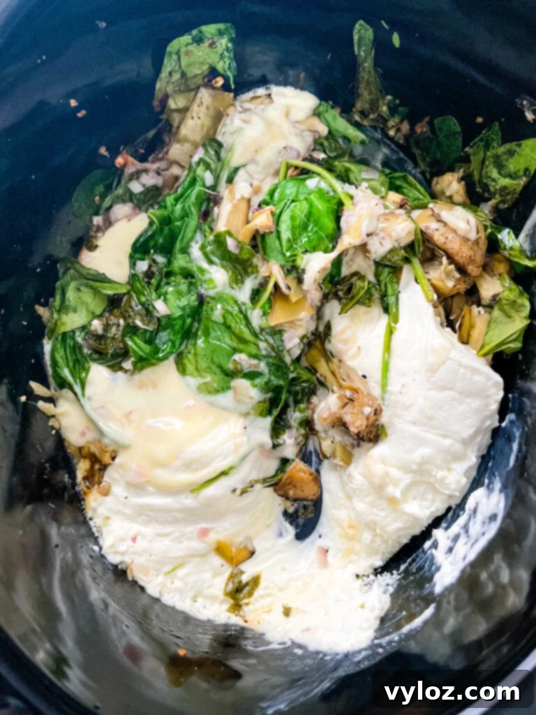 bacon spinach artichoke dip in a slow cooker