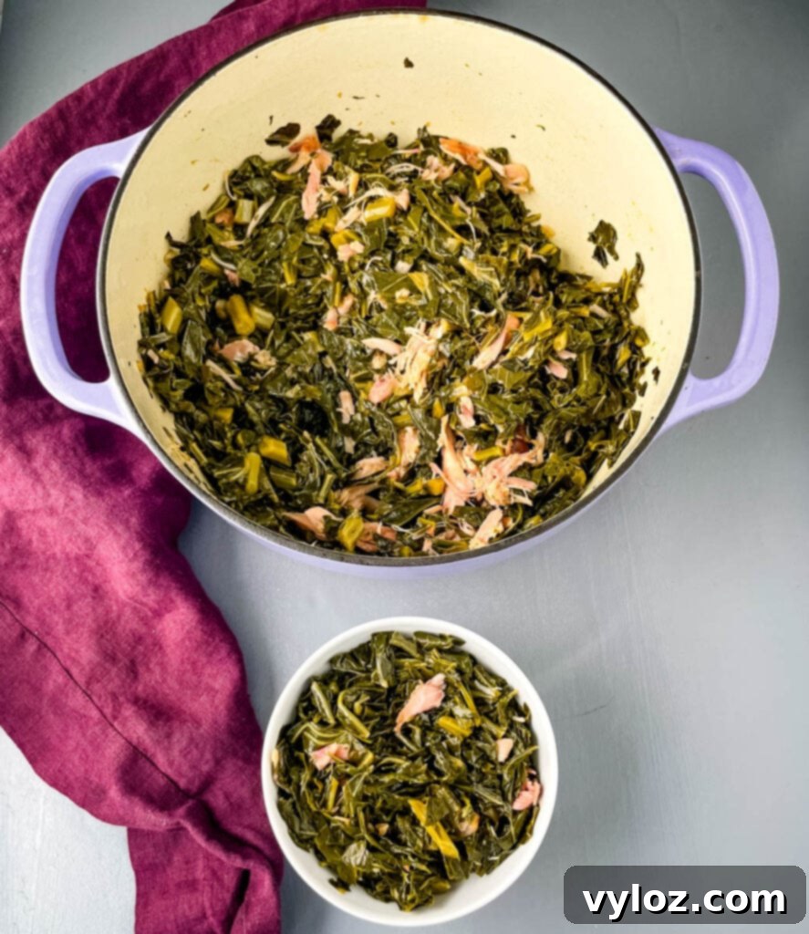 A large pot of Southern collard greens simmering, ready to be served.