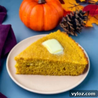 Homemade pumpkin cornbread on a plate, ready to be served
