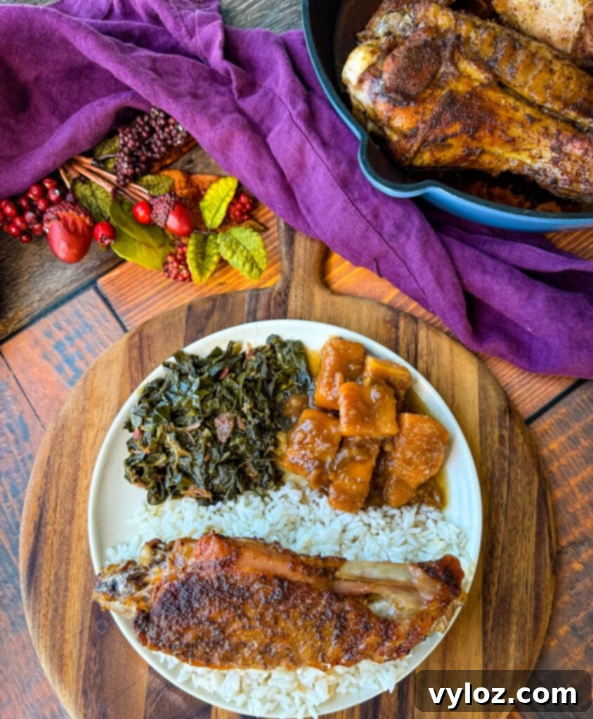 Succulent Roasted Turkey Wings 15 baked turkey wings on a plate with collard greens, sweet potatoes, and white rice