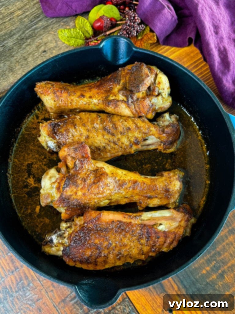 Succulent Roasted Turkey Wings 8 baked turkey wings in a cast iron skillet with chicken broth