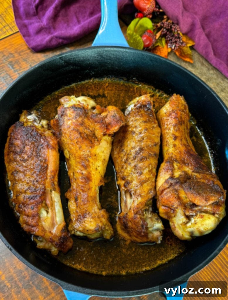 Succulent Roasted Turkey Wings 9 baked turkey wings in a cast iron skillet with chicken broth